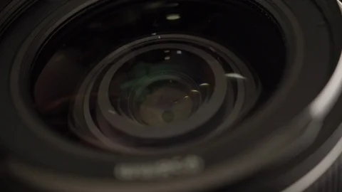 Close view of lens. Adjusting focus, aperture and exposure on dslr camera. Stock Footage 129358561