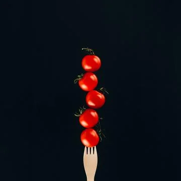 Close view levitating cherry tomatoes Stock Photos