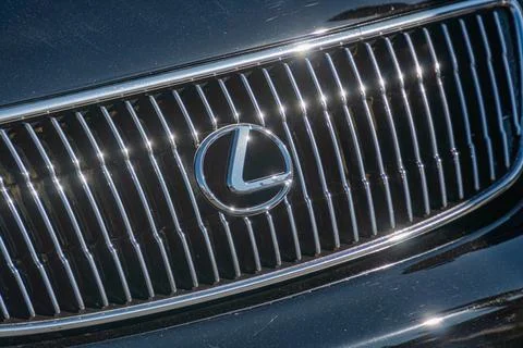 Close-up view of a Lexus car, angled from above, with a dark colored grille f Stock Photos