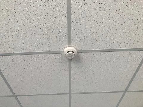 Close-up view of a light gray, patterned ceiling tile in a Ukrainian hospit.. Stock Photos