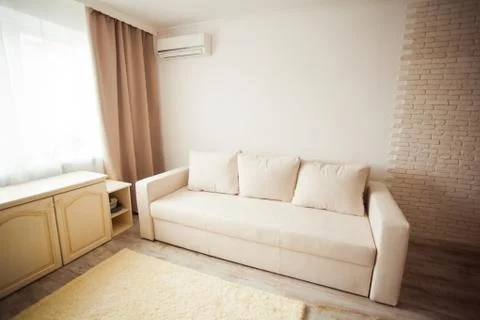 Close view light sofa indoors cozy living room Stock Photos