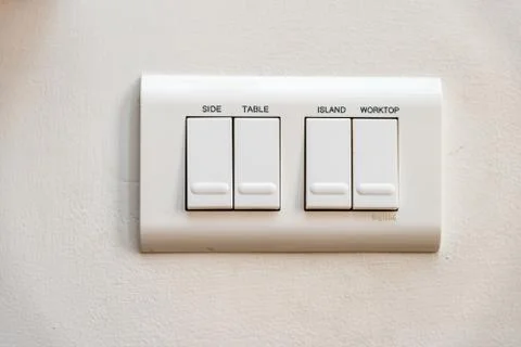 Close up view light switches with names on it Stock Photos