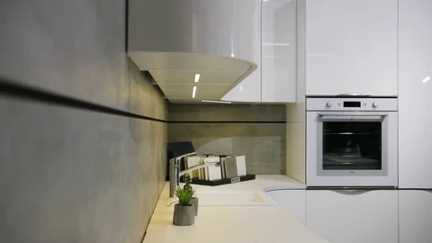 Close up view of light white stylish part of the kitchen in the modern style. Stock Footage