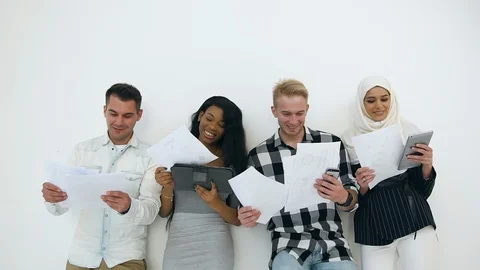 Close view of likable joyful different colour office workers which standing near Stock Footage 121842336