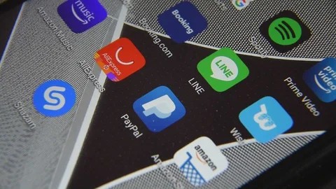 Close-up view of Line icon app on an Android smartphone, including other icons. Stock Footage 128379401