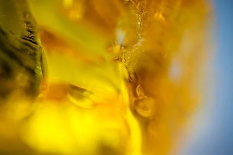 Close up view of a liquid with bubbles and textures under bright light duri.. Stock Photos