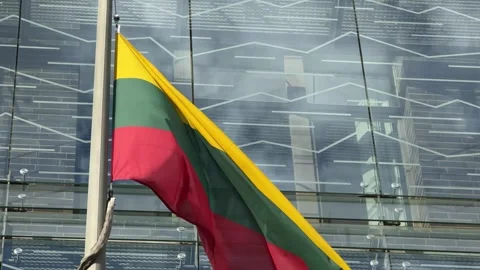Close View of Lithuanian Flag Waving Against Glass Facade Stock Footage 341397539