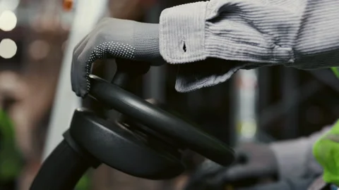 Close Up View of the Logistic Worker Hands Driving the Forklift. Stock Footage 245140233