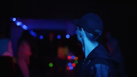 Close up view of lonely unrecognizable man in cap standing in front of the Stock Footage 111221023