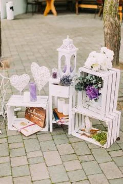 Close-up view of the lovely wedding composition of the vintage candle stands and Stock Photos