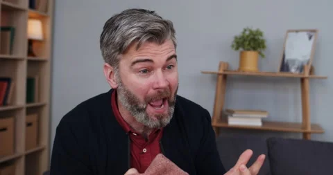 Close up view of mad bearded man communicating at psychologist at session Stock Footage 150050033