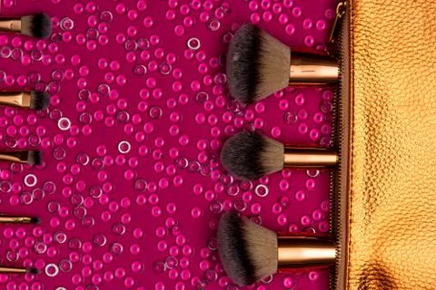 Close up view of makeup brushes and cosmetic bag Stock Photos