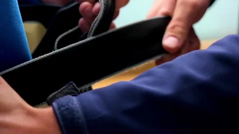Close up view of male climber attaching carabiners and equipment on safety belt 스톡 동영상 70507326