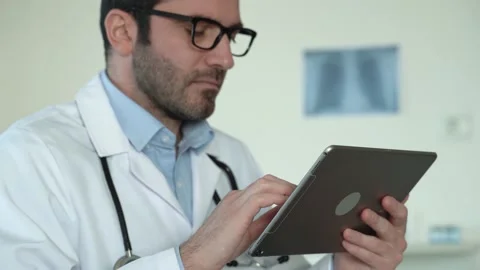 Close up view of male doctor using tablet . Stock Footage 168461860