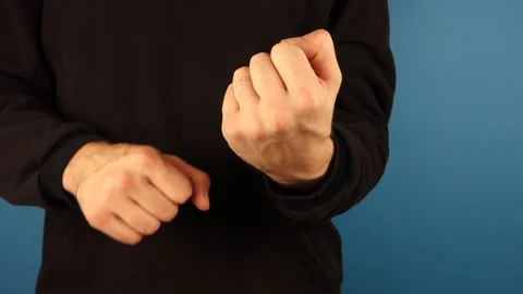 Close up view of a male gesturing with his middle finger, indicating his Stock Footage 118617340