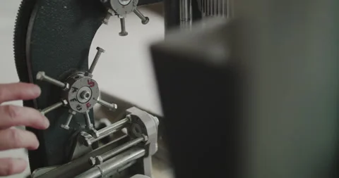 Close view of male hand tests the machine spinning mechanism Stock-Footage 130558674