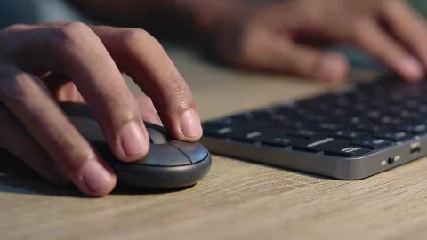 Close up view of male hands on computer keyboard and mouse Stock Footage 320061323