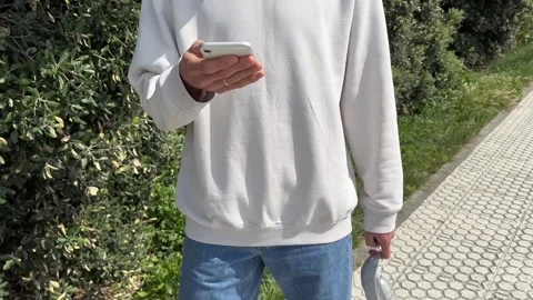 Close up view of male hands using smartphone scrolling, browsing, surfing Stock Footage 241501742