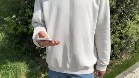 Close up view of male hands using smartphone scrolling, browsing, surfing Stock Footage 241501744