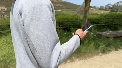 Close up view of male hands using smartphone scrolling, browsing, surfing Stock Footage 241737172