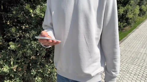 Close up view of male hands using smartphone scrolling, browsing, surfing Stock Footage 244368559