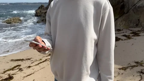 Close up view of male hands using smartphone scrolling, browsing, surfing Stock Footage 244368562