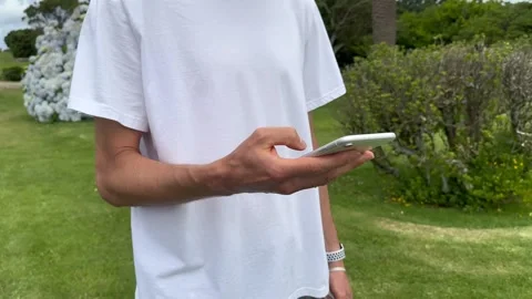 Close up view of male hands using smartphone scrolling, surfing internet Stock Footage 245916515