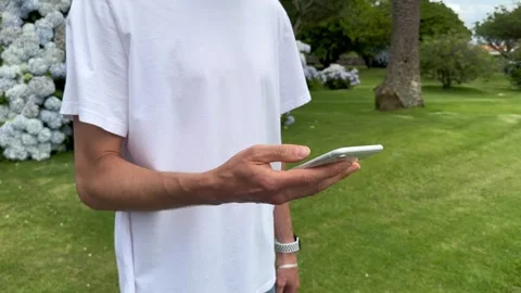 Close up view of male hands using smartphone scrolling, browsing, surfing Stock Footage 245916517