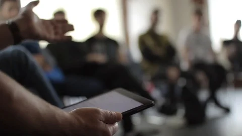 Close-up view of male's hands at seminar on the blurred backgroung Video stock 92300840
