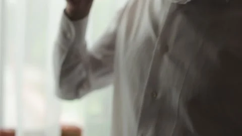 Close up view of man with drinks hot coffee or tea, enjoying beautiful morning Stock Footage 196004257