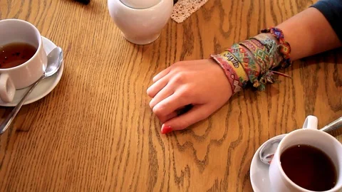 Close-up view of the man hand holding the arm of the woman. Stock Footage 95273508