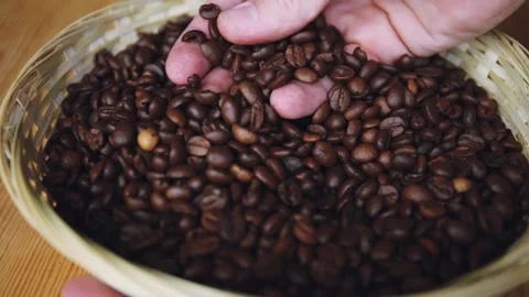 Close up view of man hand holding roasted coffee beans Stock-Footage 150402780