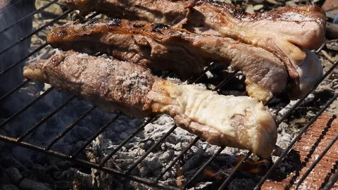Close up view of man hands cooking roast beef meat. Outdoors barbecue Stock-Footage 128063820