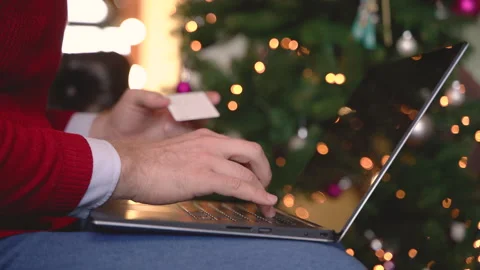 Close up view of man hands typing on laptop over her legs sitting near the Stock Footage 260946692