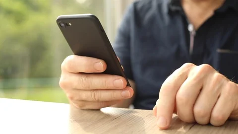 Close up view of man hands using smartphone bearded male person using phone 스톡 동영상 110840701