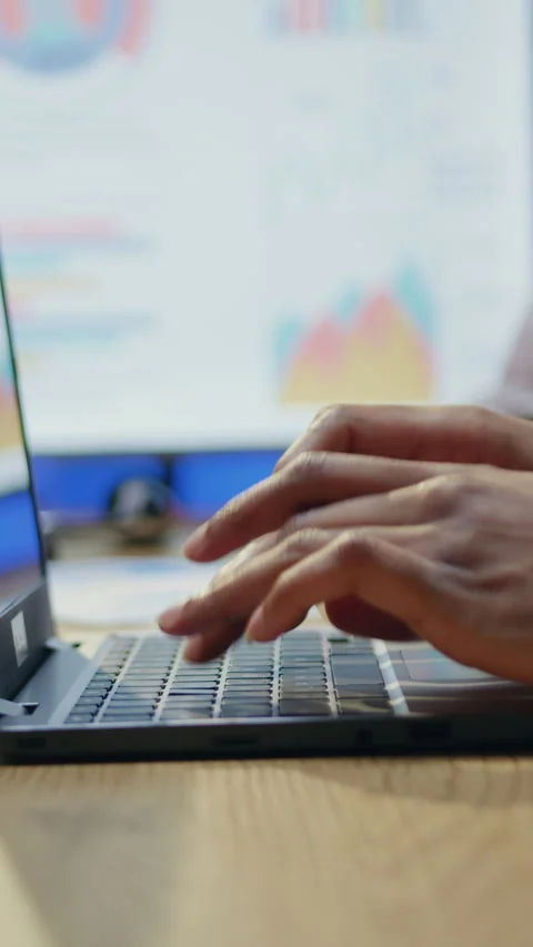 Close view on man hands which typing on keyboard entering needed information int Stock Footage 329186596