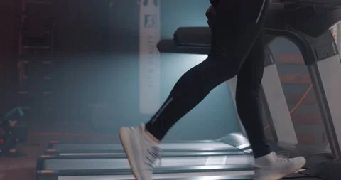 Close up view of man legs in sneakers running on treadmill at gym, slow motion Stock Footage 150295380