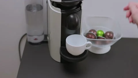 Close up view of a man loading coffee capsules into a coffee machine. Sweden. Stock Footage 171244915