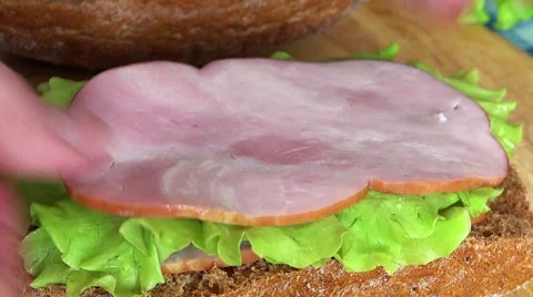 Close-up View of Man Making a Delicious Sandwich Stock Footage 49913092