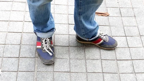 Close up view of man' s legs and feet stamping on the ground. Stock Footage 107139495