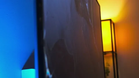 Close up view of man smashes an LCD TV with his hands. fit of rage. Slow motion Stock Footage 219341514