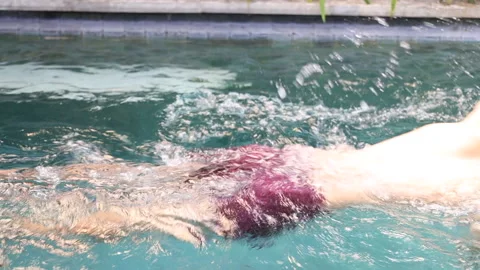Close up view of Man swimming on private swimming pool. Stock Footage 159857439
