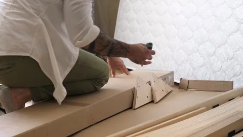 Close up view of man with the tattoo on the hand opens the box with the details Stock Footage 248349531