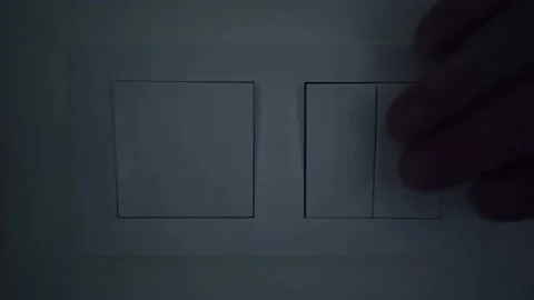 Close-up view of man Turns On and Off the light in the room Stock-Footage 122095891