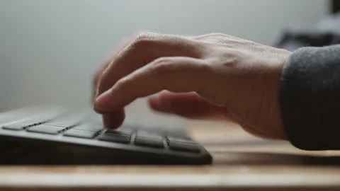 Close-up view of man typing on computer keyboard. Working from home Stock-Footage 153124744