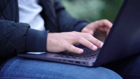 Close-up View of Man Using Laptop in the city street. 4K Video Clip Stock Footage 97850451