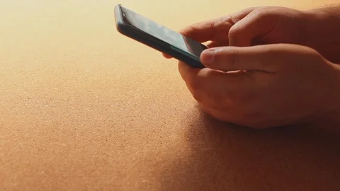 Close-up view of man using a mobile phone 스톡 동영상 98410189