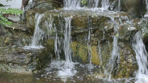 Close up view the manmade cliff rock at waterfall while water falling hit t.. Stock Footage 274485645