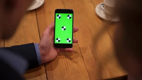 Close up view of man’s hand using the phone in the café. Modern life Video stock 73752092