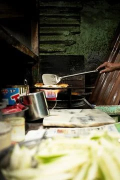 Close-up view of a man's hands making martabak Stock Photos